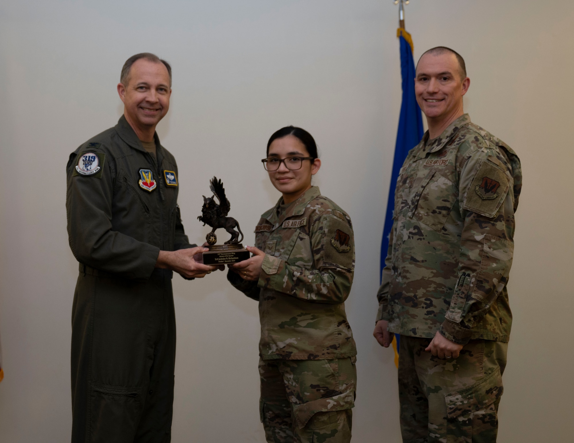 Airman accepts award at the 4th quarterly awards.