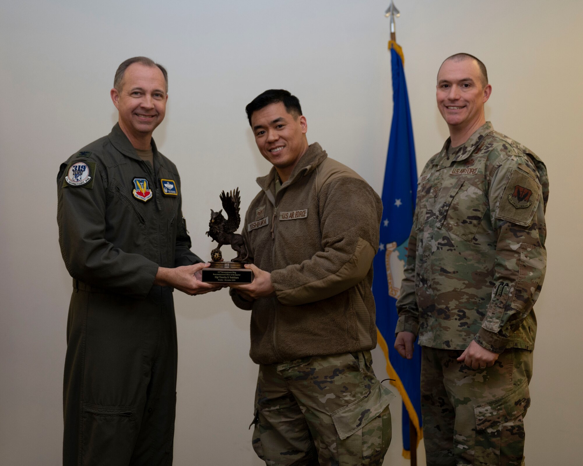 Airman accepts award at the 4th quarterly awards.