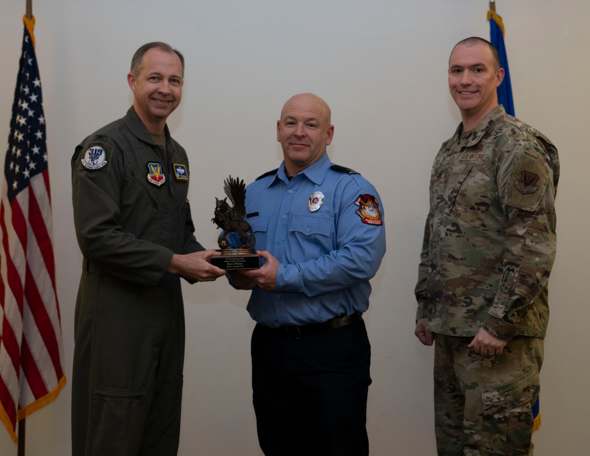 Brian Williams accepts the Category I Civilian of the Quarter Award