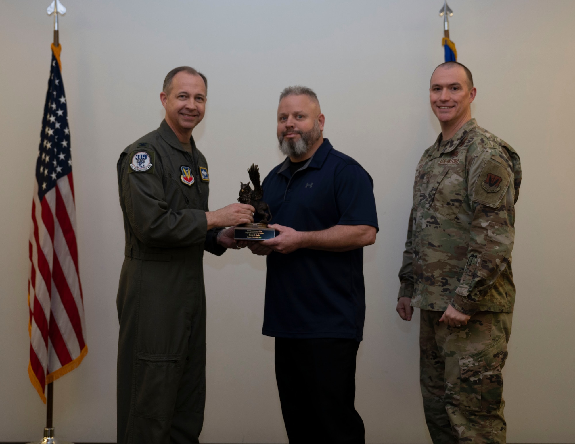 Airman accepts award at the 4th quarterly awards.