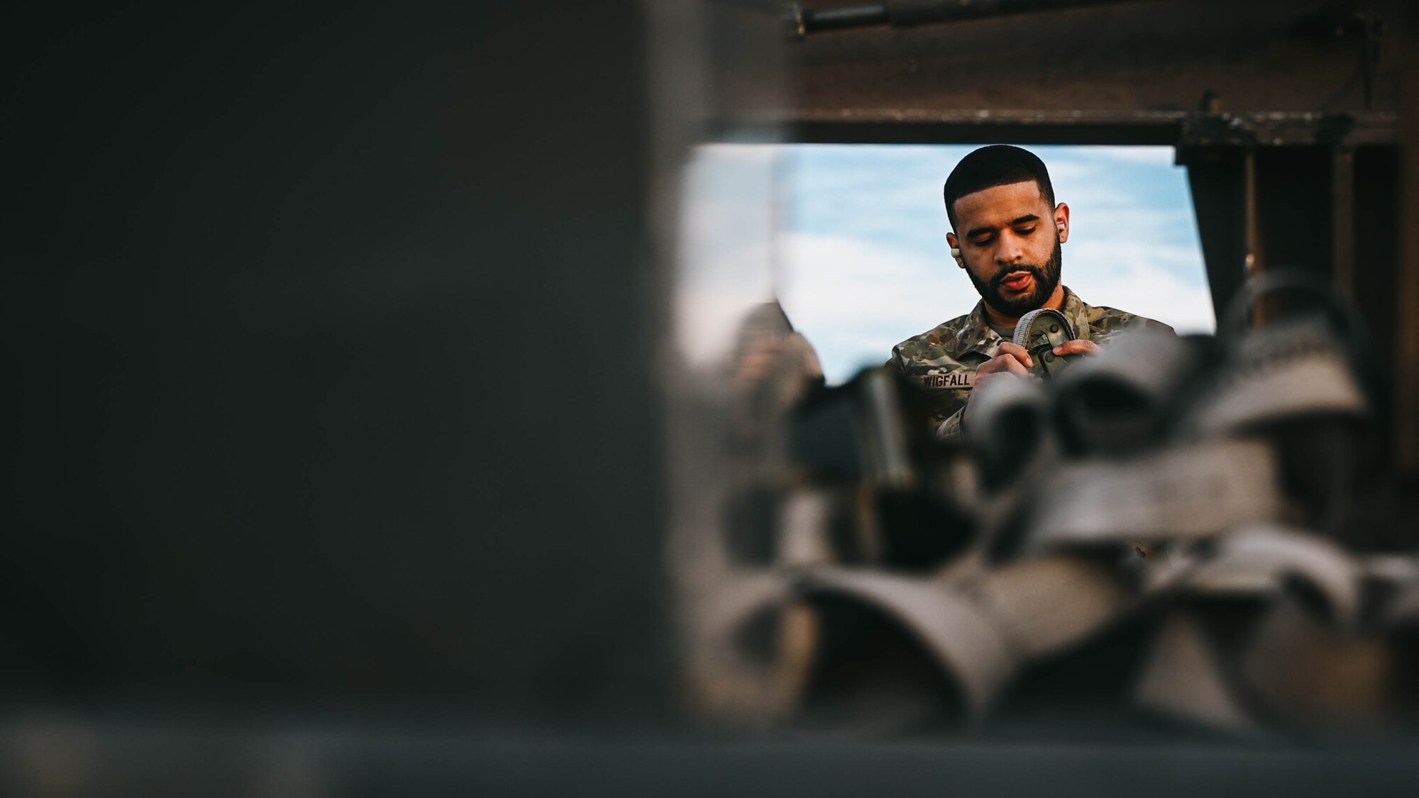 U.S. Air Force Tech. Sgt. Jacob Wigfall, 56th Maintenance Group loading standardization crew member, prepares an MHU-141 trailer.