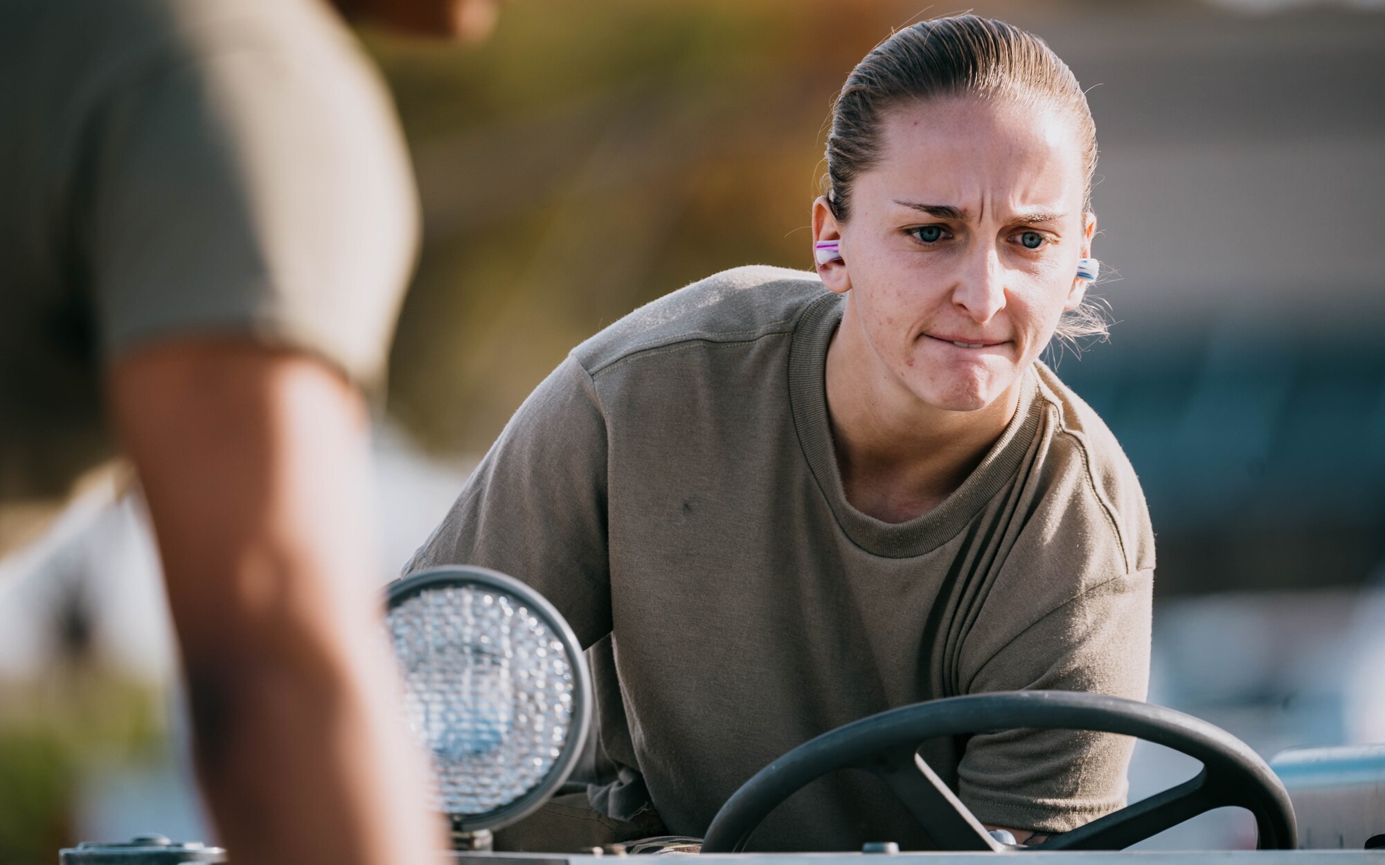 U.S. Air Force Senior Airman Kristen Hayes, 61st Aircraft Maintenance Unit weapons load crew member, navigates a jammer.