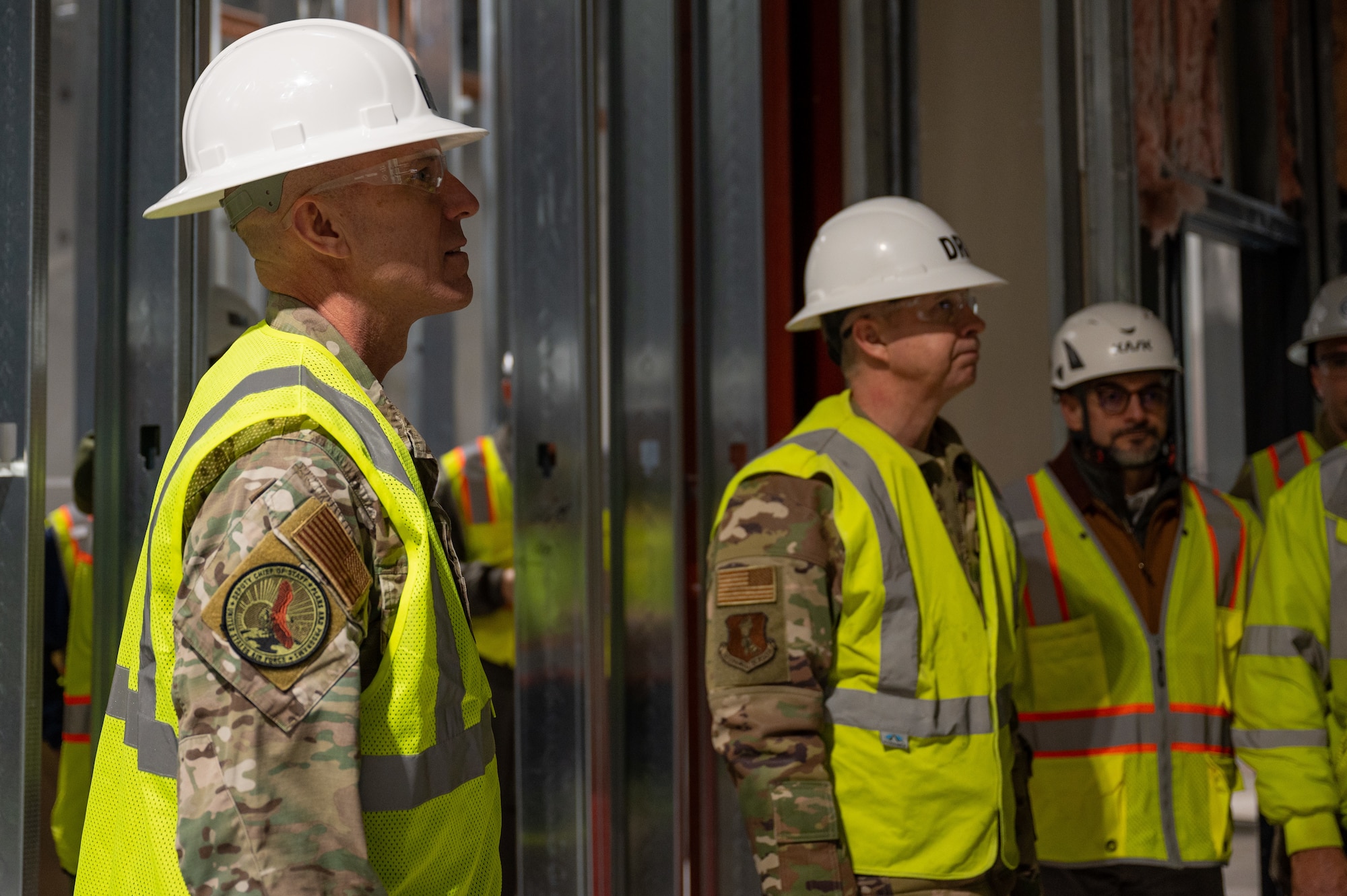 (From left to right) Lt. Gen. David Tabor, Air Force deputy chief of staff for plans and programs and Col. Timothy Monroe, 319th Reconnaissance Wing commander, walk through the construction site of the Disaster Resilience Program center at Grand Forks Air Force Base, N.D., Jan. 29, 2025.