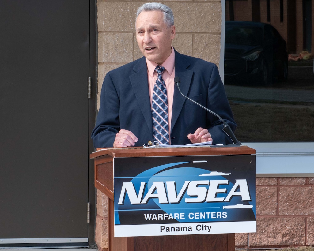 Dr. Joseph Lopes, Naval Surface Warfare Center Panama City Division Subsea and Seabed Warfare and Maritime Operations Department deputy, addresses the crowd before the ceremonial ribbon-cutting of Naval Surface Warfare Center Panama City Division's new Acoustic Test Facility and Instrumentation building, Feb. 5. Lopes was one of the visionaries behind this state-of-the-art facility. (U.S. Navy photo by Eddie Green)