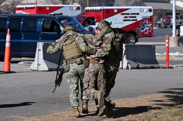 Two Airman carry a wounded actor