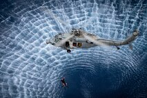An MH-60S Seahawk, assigned to the “Black Knights” of Helicopter Sea Combat Squadron (HSC) 4, conducts search and rescue training with Sailors assigned to the Nimitz-class aircraft carrier USS Carl Vinson (CVN 70) Feb. 7, 2025.