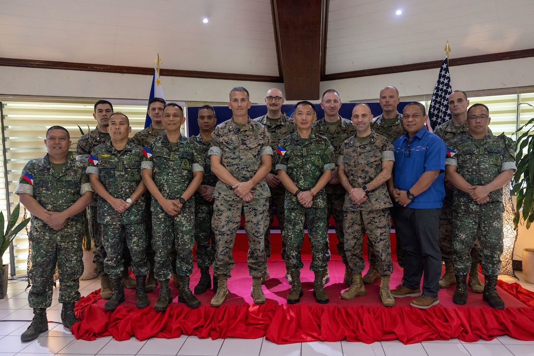 Participants pose for a group photo after the 2025 Philippine Marine Corps-U.S. Marine Corps Forces, Pacific Marine-to-Marine Staff Talks at Fort Bonifacio, Philippines, Feb. 6, 2025. The three-day talks provided a forum to improve coordination of bilateral exercises and operations while discussing mutual areas of interest throughout the Indo-Pacific. (U.S. Marine Corps photo by Lance Cpl. Chloe Zimmerer)