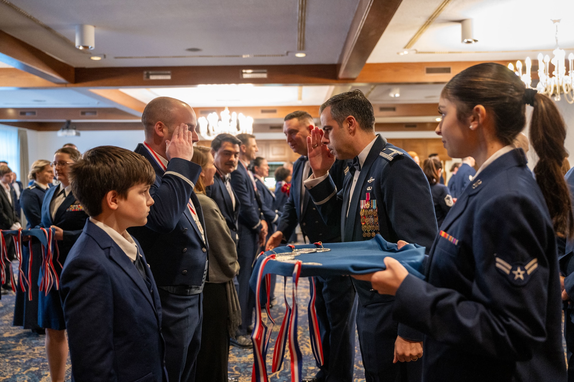 The 86th Airlift Wing award nominees receive medallions from the 86th AW command team during the 86th AW Annual Awards Ceremony at Ramstein Air Base, Germany, Feb. 7, 2025. The ceremony began with each nominee receiving a medallion to recognize their accomplishments in 2024.