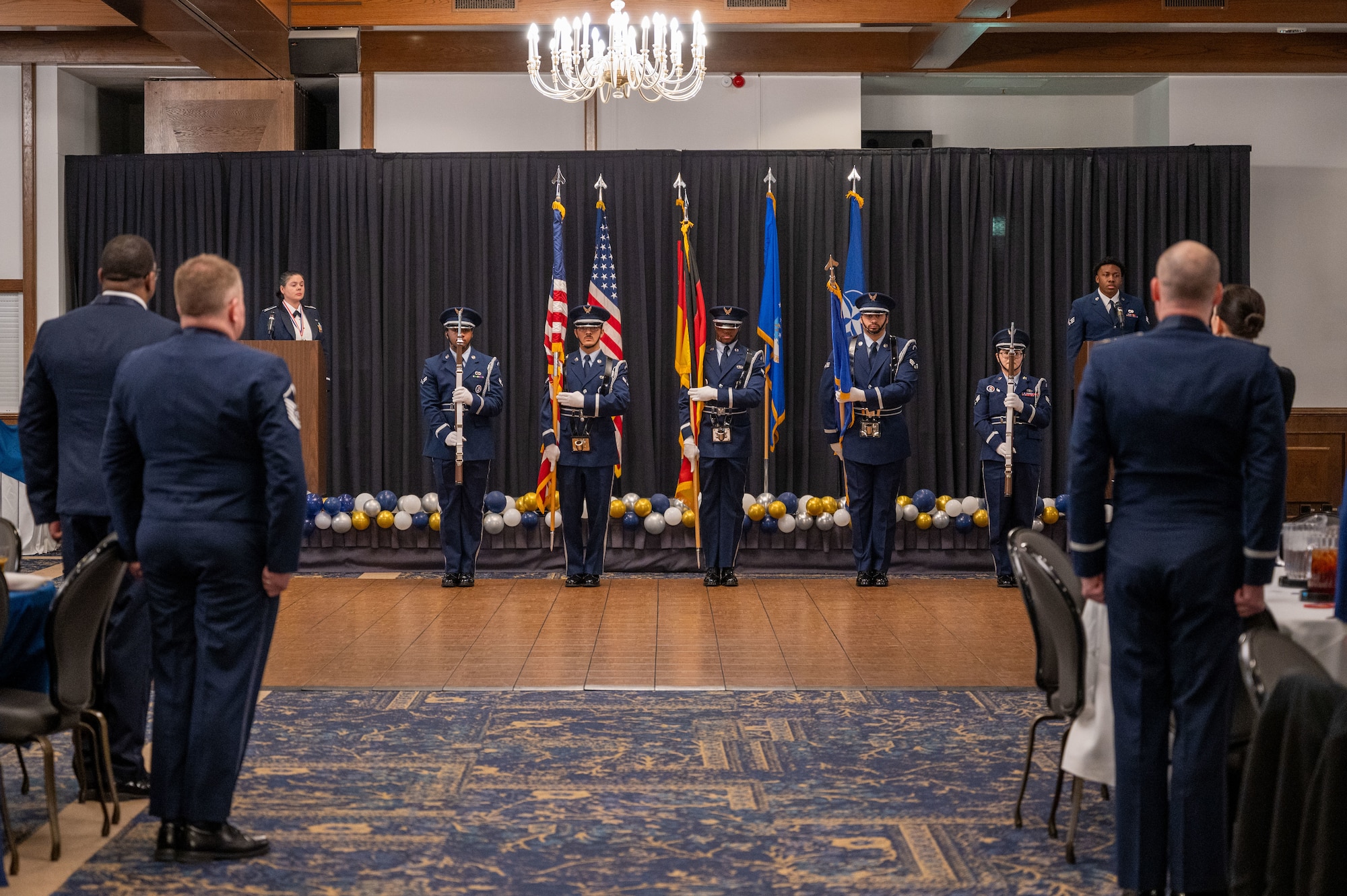Members of the Ramstein Air Base Honor Guard present colors during the 2024 86th Airlift Wing Annual Awards Ceremony, held to recognize exceptional airmen at Ramstein Air Base, Germany, Feb. 7, 2025. Leaders from the 86th AW recognized the award winners and nominees for their hard work and dedication throughout 2024.