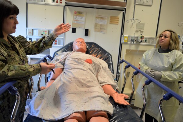 Making an inpatient point…Lt. Barbara Kent, Pediatric Clinic department head and Navy Nurse Corps officer, guides staff nurses through the What’s Wrong with the Room training module during Naval Hospital Bremerton’s Skills Fair, designed for critical multidisciplinary skill sustainment. Nurse Corps officers assigned to the main hospital, from the branch health clinics located on Naval Base Kitsap and Naval Base Everett, civilian registered nurses and hospital corpsmen were provided five training modules, Feb. 11, 2025, designed to refresh their proficiency levels which in an ambulatory care setting like NHB they might not use as much as they used to (Official Navy photo by Douglas H Stutz, NHB/NMRTC Bremerton public affairs officer).