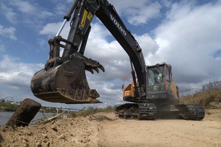 A U.S. Soldier with the Texas Army National Guard, assigned to the Texas Tactical Border Force, clears brush and shores up the edge of a path along the U.S. side of the Rio Grande River near Roma, Texas, to aid U.S. Border Patrol's ability to move throughout the area and monitor for possible illegal border crossings, Feb. 5, 2025.