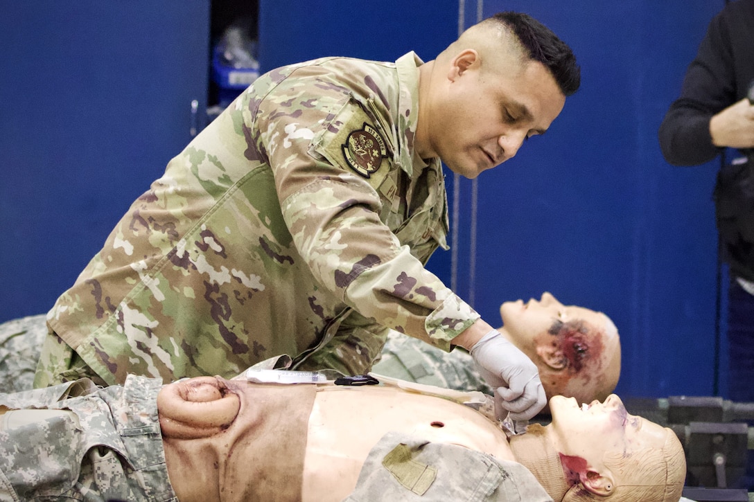 U.S. Air Force Tech. Sgt. Carlos Patino, a medic assigned to Detachment 1, Medical Group, 193rd Special Operations Wing, Pennsylvania National Guard, performs lifesaving techniques on simulated patients during a mass casualty exercise at Penn State Health Milton S. Hershey Medical Center in Hershey, Pennsylvania, Feb. 7, 2025. Patino was one of three Airmen who are nurses or medics who completed an inaugural two-week training program, which is a new partnership between the National Guard and MSHMC, where participants learn how to respond effectively in emergencies and combat situations. (U.S. Army National Guard photo by Maj. Travis Mueller)