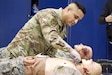 U.S. Air Force Tech. Sgt. Carlos Patino, a medic assigned to Detachment 1, Medical Group, 193rd Special Operations Wing, Pennsylvania National Guard, performs lifesaving techniques on simulated patients during a mass casualty exercise at Penn State Health Milton S. Hershey Medical Center in Hershey, Pennsylvania, Feb. 7, 2025. Patino was one of three Airmen who are nurses or medics who completed an inaugural two-week training program, which is a new partnership between the National Guard and MSHMC, where participants learn how to respond effectively in emergencies and combat situations. (U.S. Army National Guard photo by Maj. Travis Mueller)
