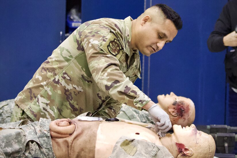 U.S. Air Force Tech. Sgt. Carlos Patino, a medic assigned to Detachment 1, Medical Group, 193rd Special Operations Wing, Pennsylvania National Guard, performs lifesaving techniques on simulated patients during a mass casualty exercise at Penn State Health Milton S. Hershey Medical Center in Hershey, Pennsylvania, Feb. 7, 2025. Patino was one of three Airmen who are nurses or medics who completed an inaugural two-week training program, which is a new partnership between the National Guard and MSHMC, where participants learn how to respond effectively in emergencies and combat situations. (U.S. Army National Guard photo by Maj. Travis Mueller)