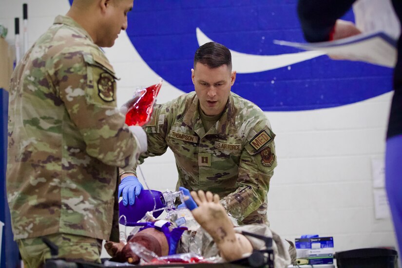 U.S. Air Force Capt. Steven Thompson, right, and Tech. Sgt. Carlos Patino, assigned to Detachment 1, Medical Group, 193rd Special Operations Wing, Pennsylvania National Guard, perform lifesaving techniques on simulated patients during a mass casualty exercise at Penn State Health Milton S. Hershey Medical Center in Hershey, Pennsylvania, Feb. 7, 2025. These Airmen completed an inaugural two-week training program, which is a new partnership between the National Guard and MSHMC, where participants learn how to respond effectively in emergencies and combat situations. (U.S. Army National Guard photo by Maj. Travis Mueller)