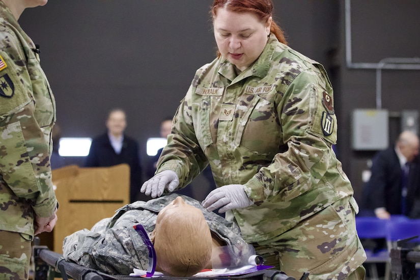 U.S. Air Force Tech. Sgt. Suzanne Nowalk, a medic assigned to Detachment 1, Medical Group, 193rd Special Operations Wing, Pennsylvania National Guard, performs lifesaving techniques on simulated patients during a mass casualty exercise at Penn State Health Milton S. Hershey Medical Center in Hershey, Pennsylvania, Feb. 7, 2025. Nowalk was one of three Airmen who are nurses or medics who completed an inaugural two-week training program, which is a new partnership between the National Guard and MSHMC, where participants learn how to respond effectively in emergencies and combat situations. (U.S. Army National Guard photo by Maj. Travis Mueller)