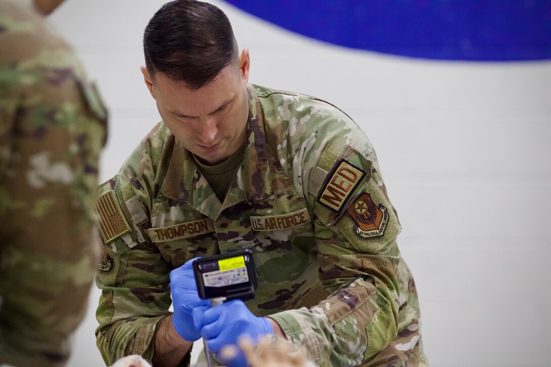 U.S. Air Force Capt. Steven Thompson, assigned to Detachment 1, Medical Group, 193rd Special Operations Wing, Pennsylvania National Guard, performs lifesaving techniques on simulated patients during a mass casualty exercise at Penn State Health Milton S. Hershey Medical Center in Hershey, Pennsylvania, Feb. 7, 2025. Thompson was one of three Airmen who are nurses or medics who completed an inaugural two-week training program, which is a new partnership between the National Guard and MSHMC, where participants learn how to respond effectively in emergencies and combat situations. (U.S. Army National Guard photo by Maj. Travis Mueller)
