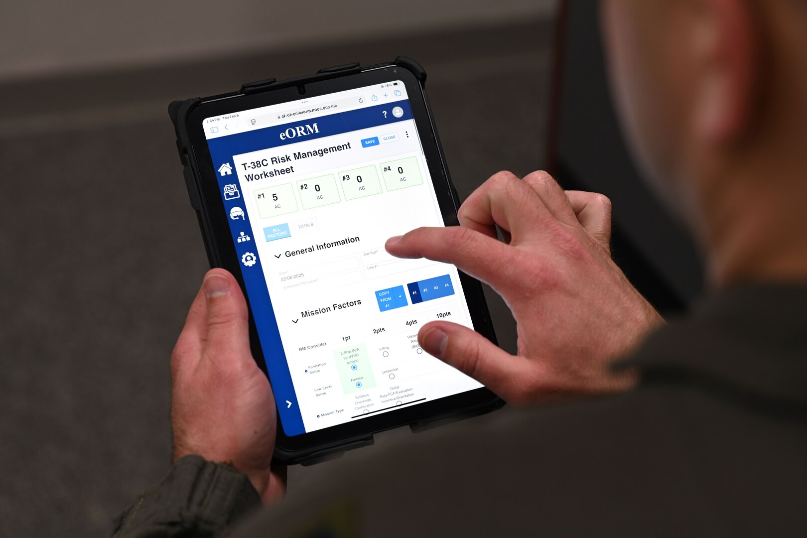 A T-38 instructor pilot pulls up a T-38 Risk Management Worksheet on the eORM app during a pre-flight brief. The eORM app enhances the risk assessment process for aircrews before every flight. It also gives flying unit commanders a clearer picture of aviation risks for each mission.