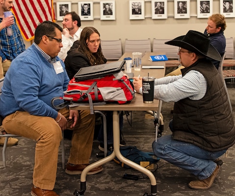 Justin Riggs, right, program manager in the New Mexico/Texas
Branch of the Albuquerque District’s Regulatory Division, speaks with emergency management officials from the Village of Ruidoso, N.M., after the Emergency Management Partnership Day, Jan. 28, 2025.