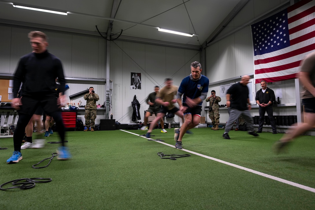 Soldiers and a high ranking defense official run suicides indoors on artificial turf.