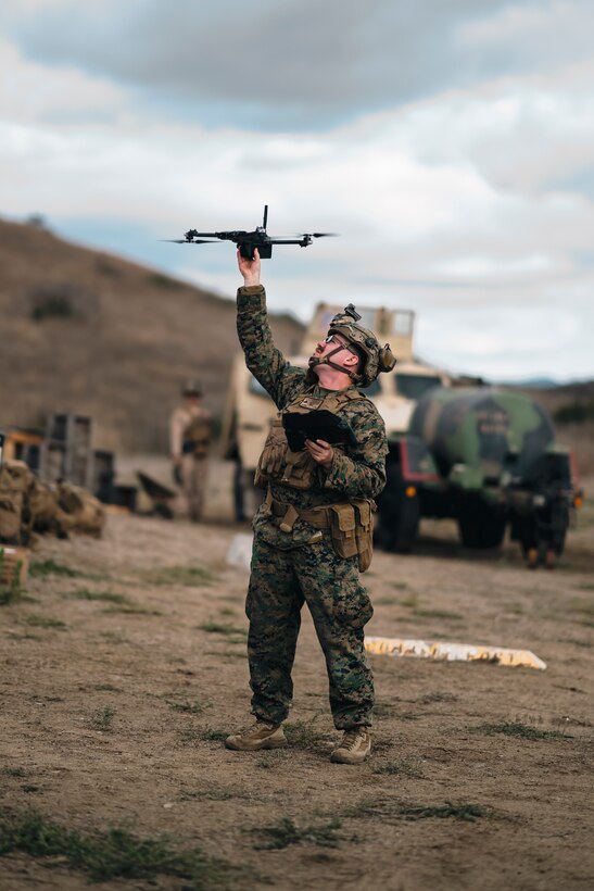 U.S. Marine Corps Lance Cpl. Justin Rowley, a student with the Small Unmanned Aircraft System Integration Course, 1st Marine Division Schools, lands a SkyDio X2D SUAS during a SUAS integration field exercise on Marine Corps Base Camp Pendleton, California, Jan. 28, 2024.