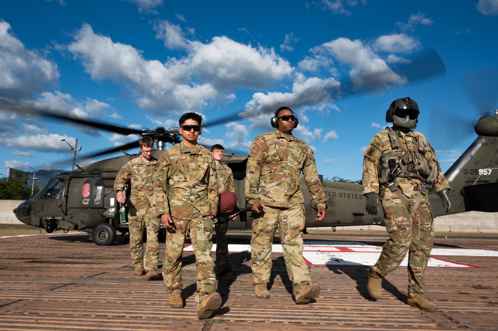 Joint Task Force-Bravo carry a dummy patient during an air enroute care training at Soto Cano Air Base, Honduras, February 5, 2025. During the three day training members learned how to assess, care for and safely load a patient into a helicopter in case of a medical evacuation. (U.S. Air Force photo by Staff Sgt. tristan Biese)