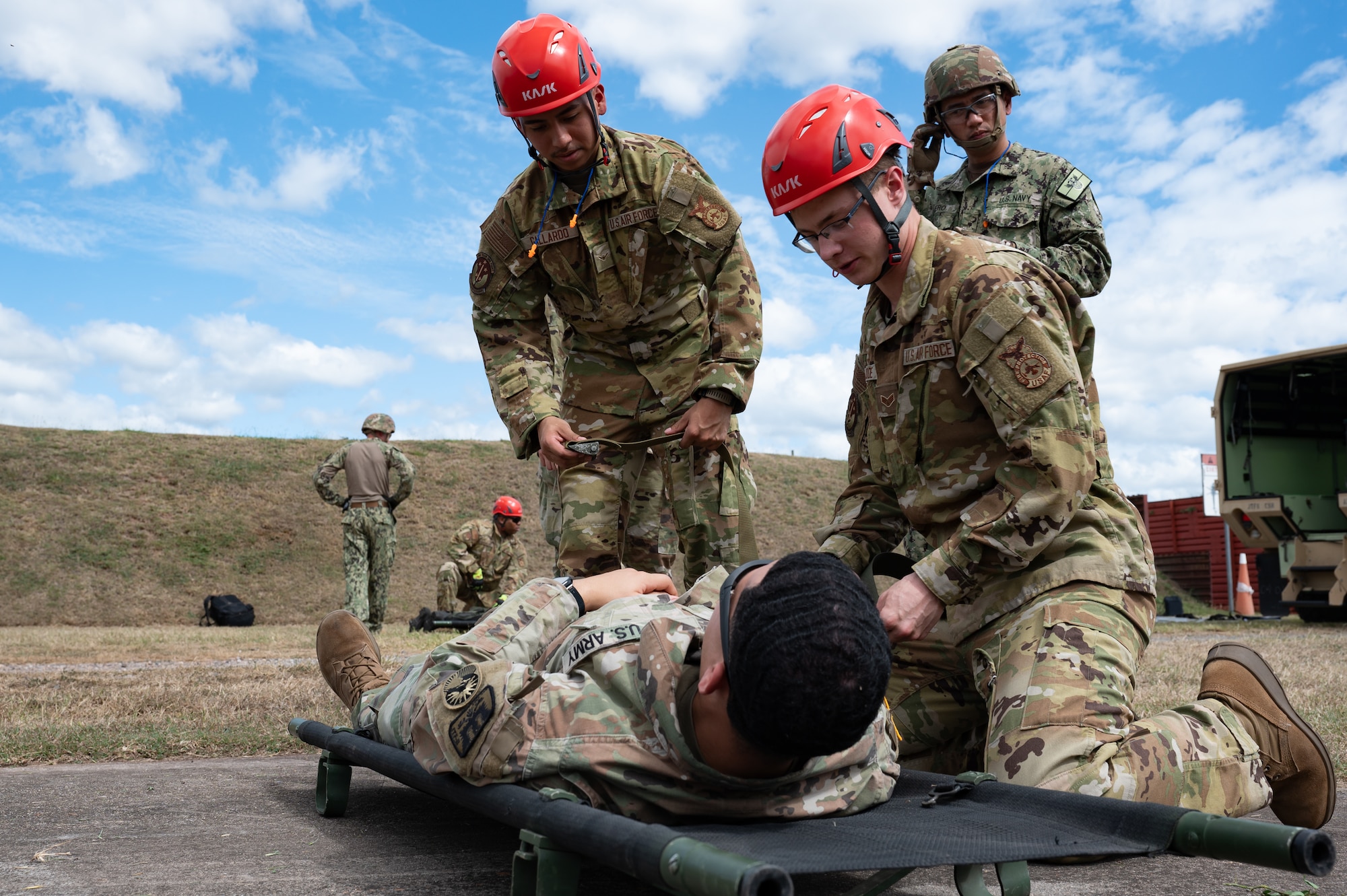 Joint Task Force-Bravo and U.S. Navy Expeditionary Medical Facility 150 Alpha, Camp Pendleton, California, members treat a patient during an air enroute care training at Soto Cano Air Base, Honduras, February 5, 2025. During the three day training members learned how to assess, care for and safely load a patient into a helicopter in case of a medical evacuation. (U.S. Air Force photo by Staff Sgt. Tristan Biese)