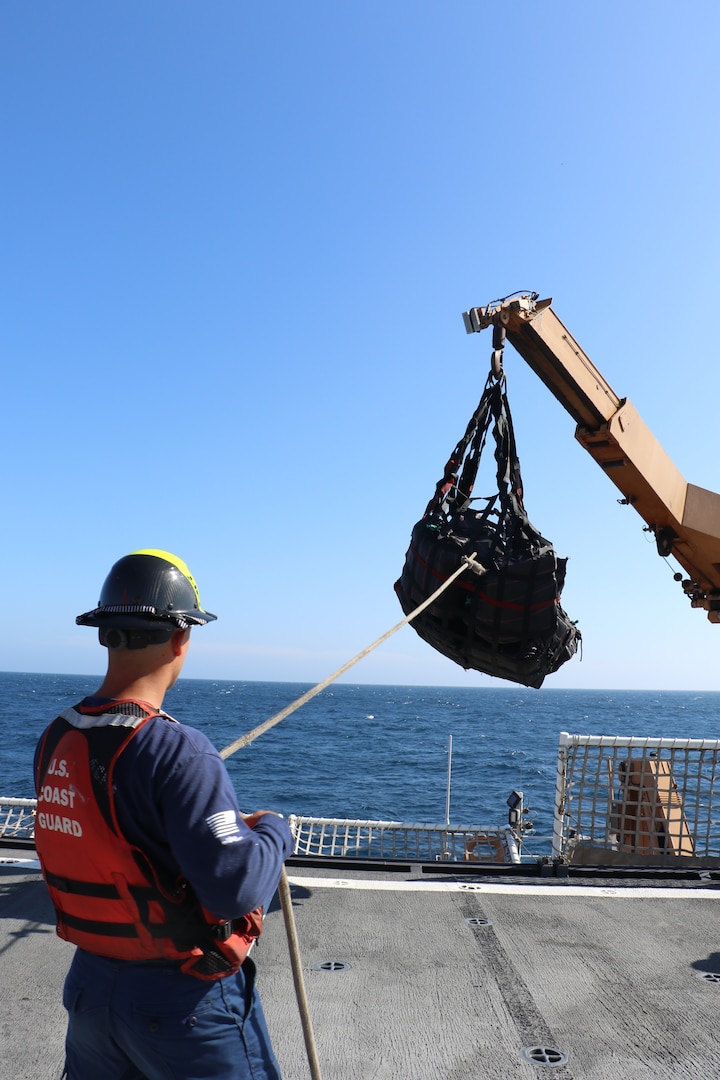 U.S. Coast Guard Cutter Waesche (WMSL 751) onloads contraband from a  Go-Fast vessel interdicted in the Eastern Pacific Ocean, Feb. 3, 2025. Waesche seized around 1,570 kgs of cocaine and apprehended three suspected drug smugglers  with the assistance of HITRON 25-03, PACTACLET LEDET 103, and ScanEagle team. (U.S. Coast Guard photo by LTJG Julia VanLuven)