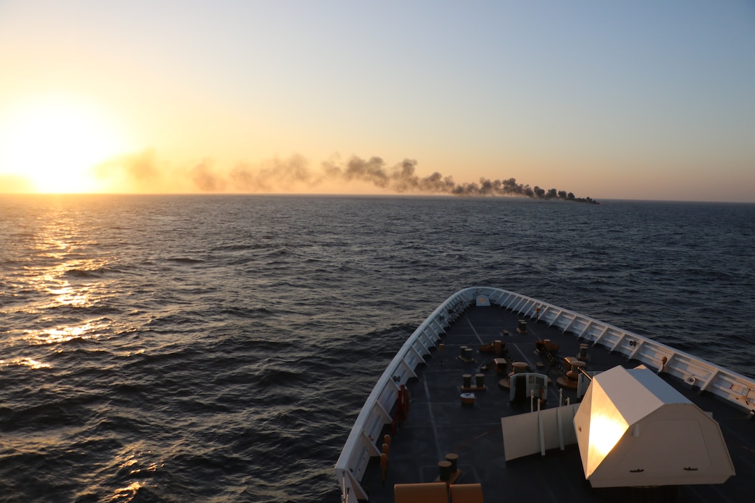 U.S. Coast Guard Cutter Waesche (WMSL 751) sinks  the Go-Fast vessel interdicted in the Eastern Pacific Ocean because it posed a hazard to navigation. Waesche interdicted the Go-Fast vessel the assistance of HITRON 25-03, PACTACLET LEDET 103, and ScanEagle team. Resulting in the seizure of 1,570 kgs of cocaine and apprehension three suspected drug smugglers  (U.S. Coast Guard photo by LTJG Julia VanLuven)