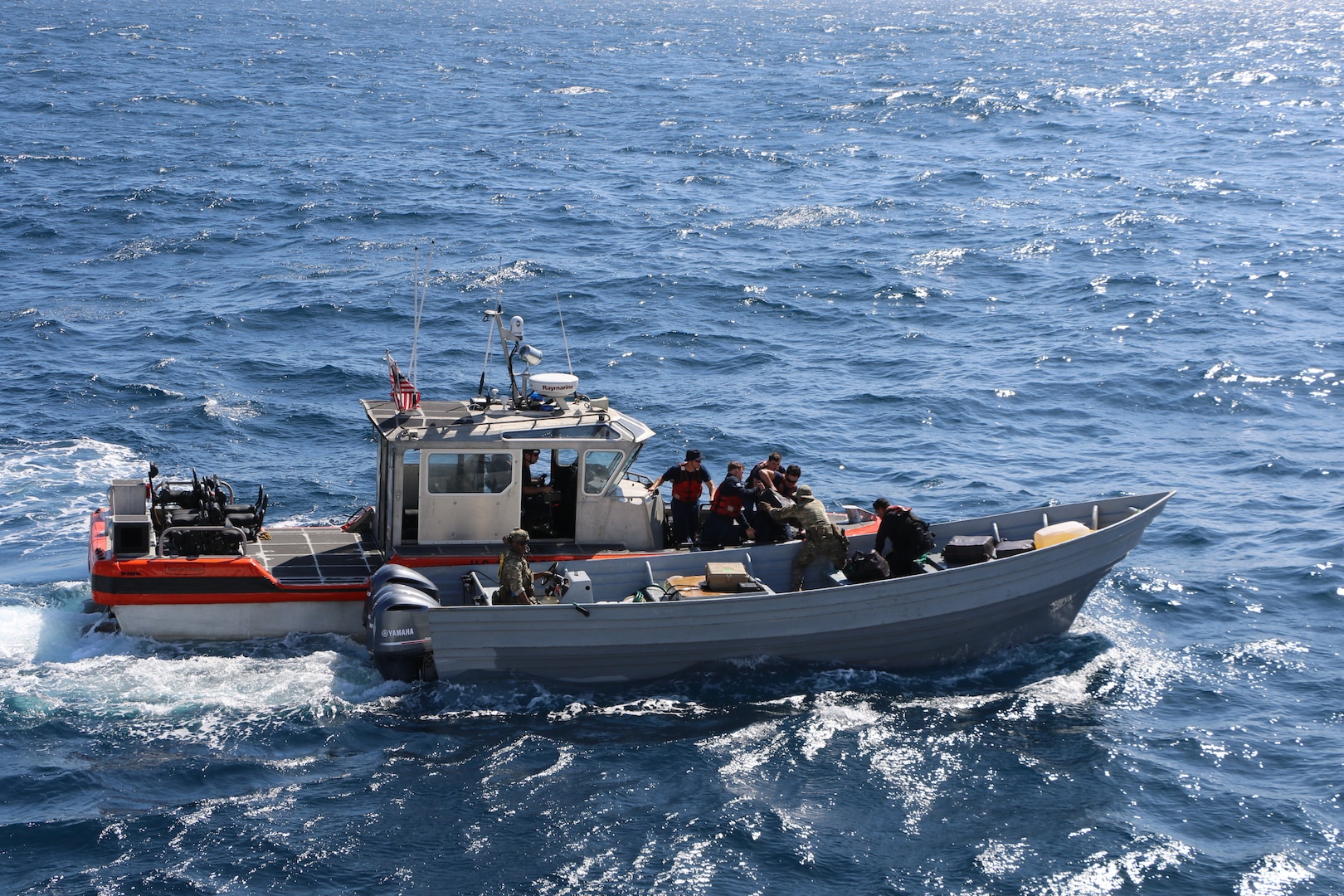 U.S. Coast Guard Cutter Waesche’s (WMSL 751) Long Range Interceptor (LRI) small boat and a Go-Fast vessel seized by Waesche, transfer the contraband. The interdiction occurred in the Eastern Pacific Ocean, Feb. 3, 2025. Waesche seized around 1,570 kgs of cocaine and apprehended three suspected drug smugglers  with the assistance of HITRON 25-03, PACTACLET LEDET 103, and ScanEagle team. (U.S. Coast Guard photo by OS2 Cody Langrall)