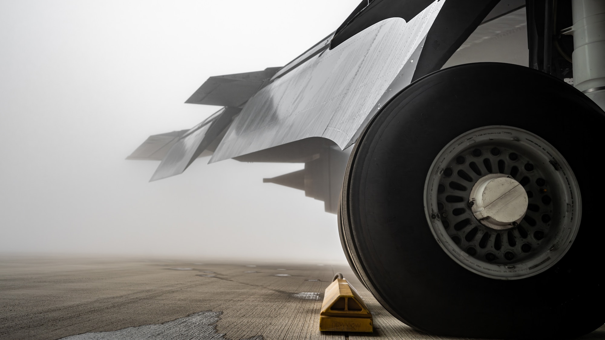An aircraft tire sits in the fog