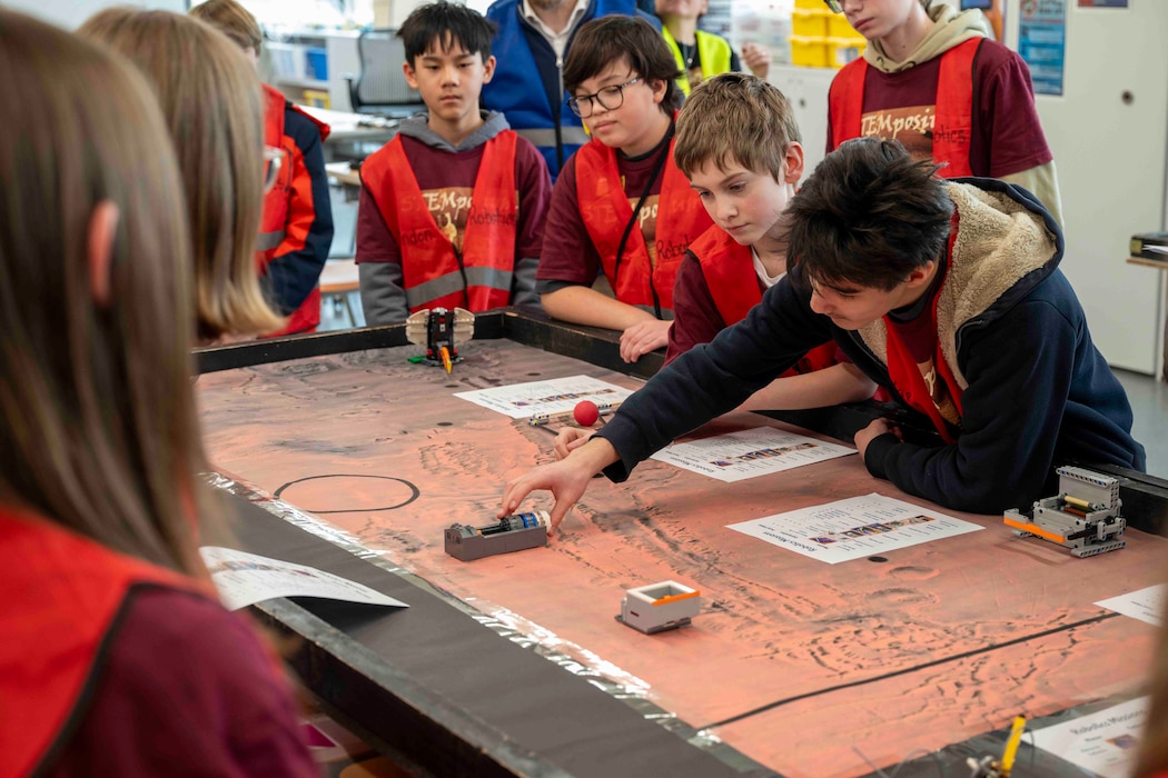 Middle School students around a table