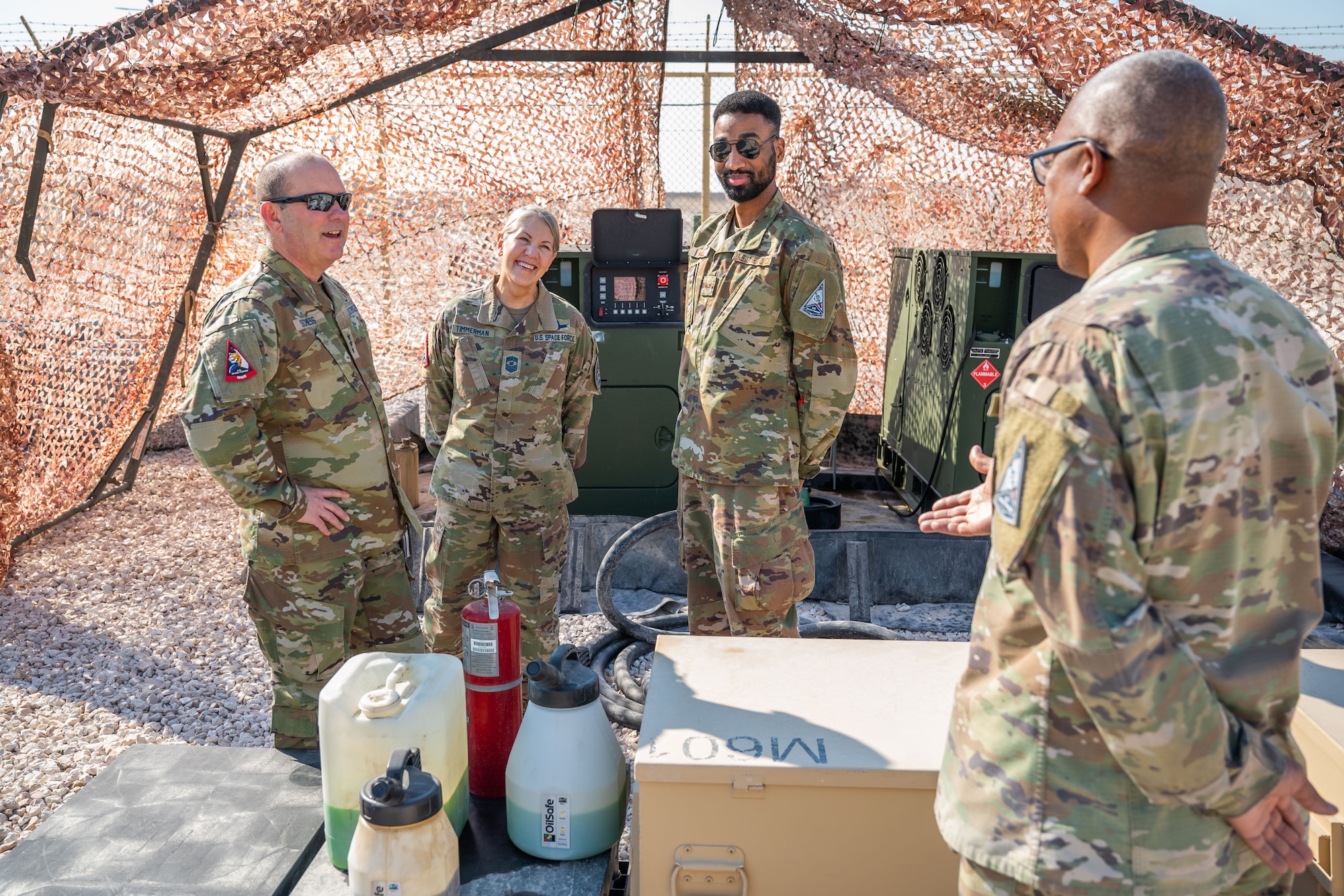 Military members stand in a group