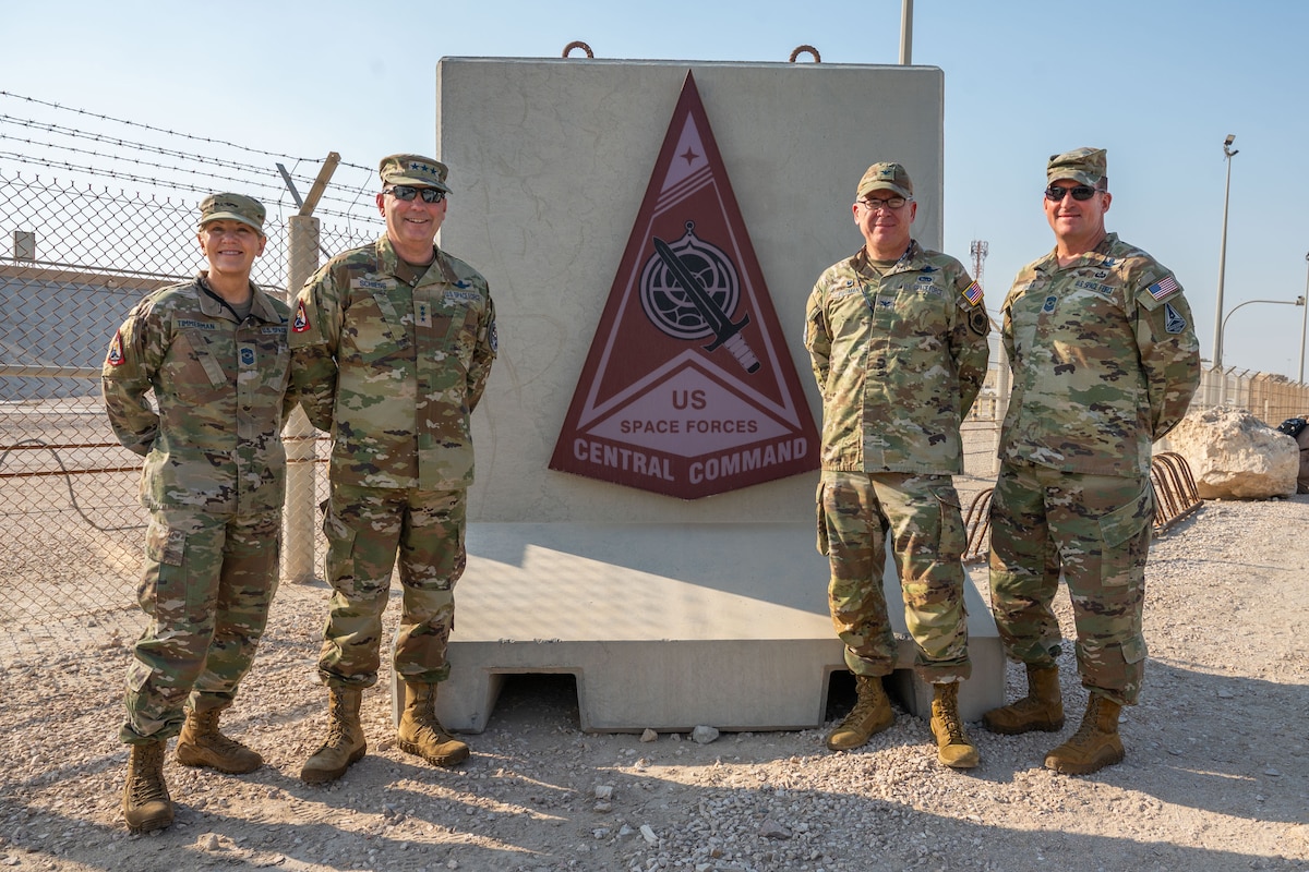 Military members stand in a group