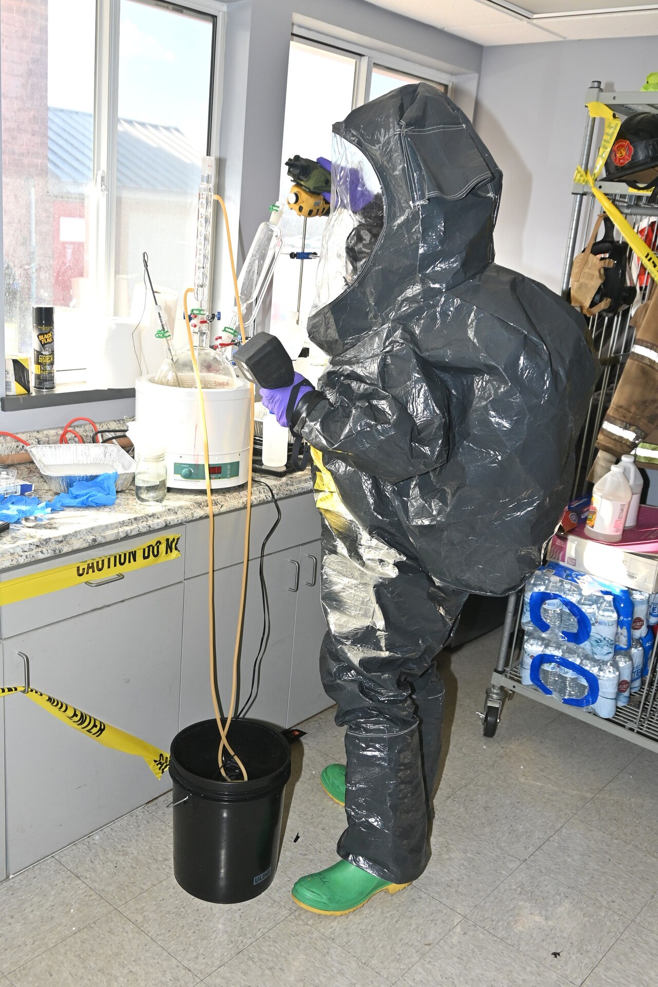 A member of the Pennsylvania National Guard’s 3rd Weapons of Mass Destruction Civil Support Team inspects a suspected drug lab during a training exercise Feb. 7, 2025, at the Lancaster County Public Safety Training Center in Landisville, Pa. (Pennsylvania National Guard photo by Brad Rhen)