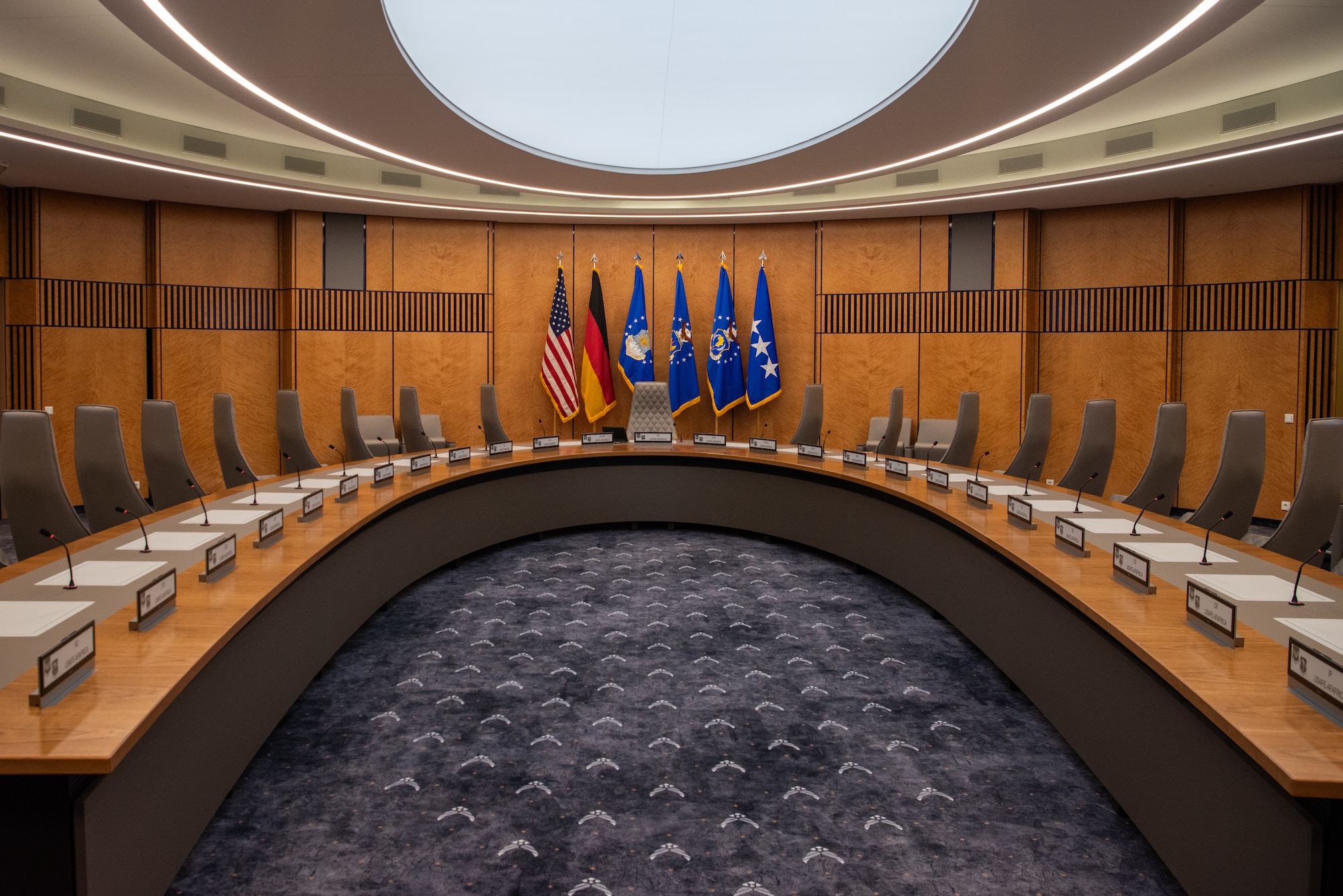 Flags are displayed in conference room.