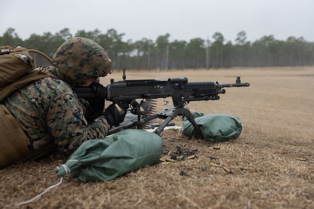 U.S. Marine Corps Lance Cpl. Cameron Ganczak, an inventory management specialist with 2nd Combat Readiness Regiment, 2nd Marine Logistics Group, and native of California, fires an M240B machine gun during a live-fire range as part of 2nd CRR’s Regimental Field Exercise on Camp Lejeune, North Carolina, Feb. 6, 2025. 2nd CRR conducted the REGFEX to enhance the regiment’s ability to support II Marine Expeditionary Force with logistical support. (U.S. Marine Corps photo by Lance Cpl. Franco Lewis)