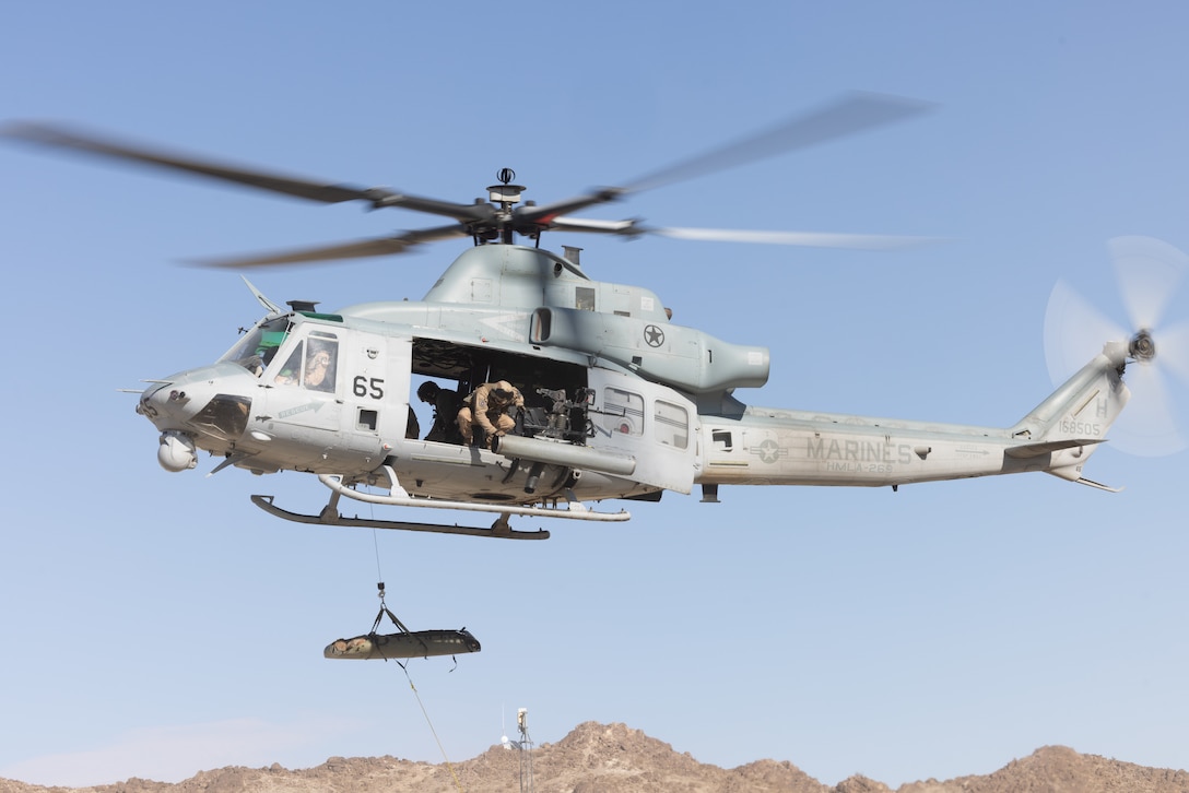 U.S. Marines with Marine Light Attack Helicopter Squadron (HMLA) 269 hoist a simulated casualty from a UH-1Y Venom at Marine Corps Air Ground Combat Center Twentynine Palms, California, Jan. 29, 2025. HMLA-269 and other squadrons assigned to 2nd Marine Aircraft Wing trained to integrate with and support Marine Corps ground units during Service Level Training Event (SLTE) 1-25, a series of training events designed to prepare Marines for operations around the globe. (U.S. Marine Corps photo by Cpl. Anakin Smith)