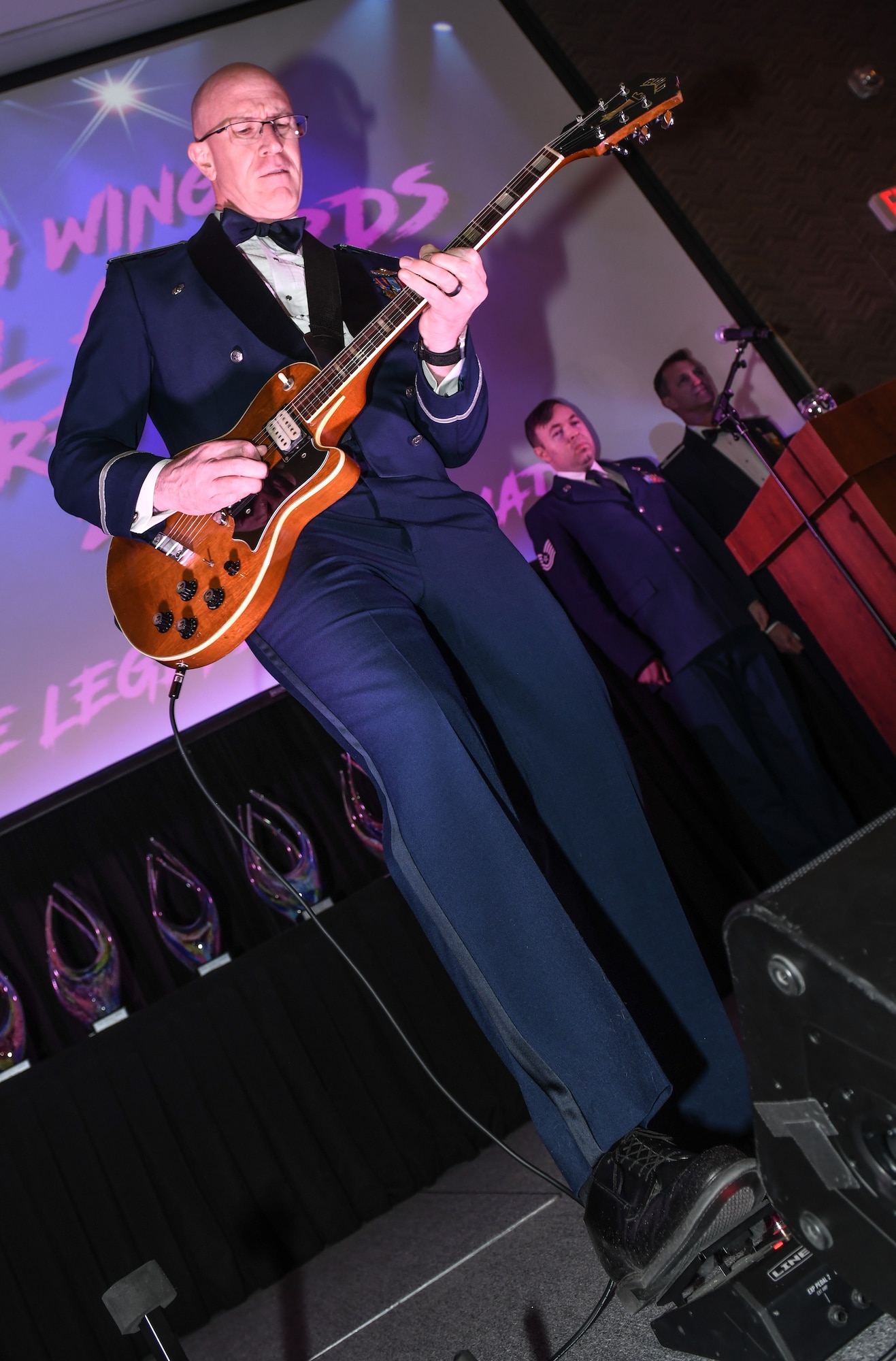 55th Wing Commander Col. Mark Howard plays the national anthem on an electric guitar to open the 2024 Annual Awards banquet the Beardmore Event Center in Bellevue, Neb. on Feb. 8, 2025. (U.S. Air Force photo by Chad Watkins)