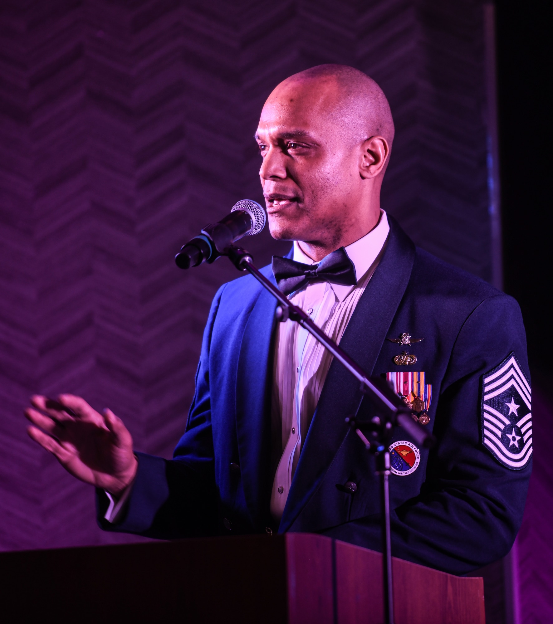 55th Wing Command Chief Master Sgt. Andrew Small speaks to the audience at the 55th Wing Annual Awards ceremony in Bellevue, Neb. on Feb. 8, 2025. Chief Small was the guest speaker at the event. (U.S. Air Force photo by Chad Watkins)