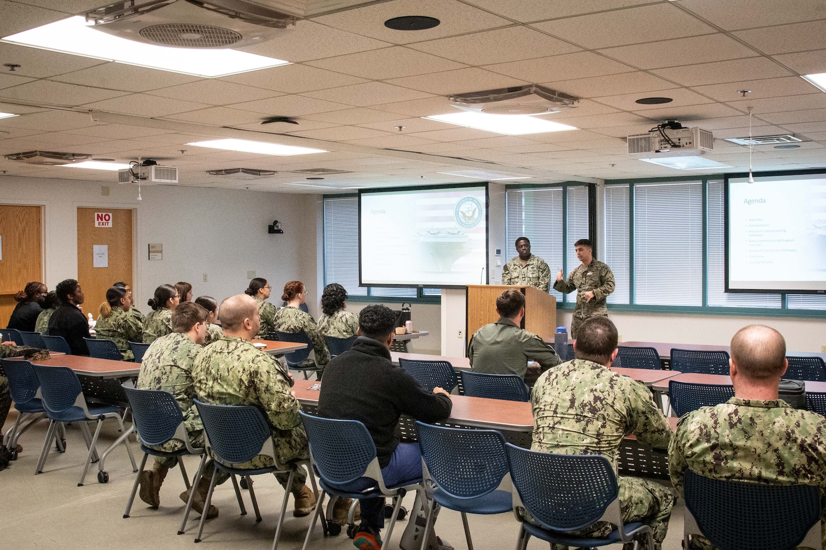 Hospital Corpsman First Class Michael Barros, center right, shares his application and acceptance experience into the U.S. Navy’s Medical Service Corps Inservice Procurement Program to fellow Sailors during a Commissioning Lunch and Learn held February 13, 2025 aboard Naval Health Clinic Cherry Point.  The mentorship session provided information to clinic Sailors about commissioning opportunities.