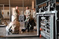 Chief Master Sgt. Israel Nuñez, Senior Enlisted Advisor to the Chief of Air Force Reserve and Command Chief Master Sgt. of Air Force Reserve Command, observes as aerial port Airmen conduct chemical warfare training at Joint Base San Antonio-Lackland, Feb. 1, 2025.