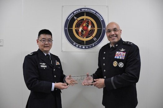  U.S. Space Force Lt. Gen. David N. Miller Jr., right, commander of U.S. Space Operations Command (SpOC), poses for a photo with a member of the Japanese Air Self-Defense Force’s Space Operations Group at Fuchu Air Base, Japan, Feb. 10, 2025.