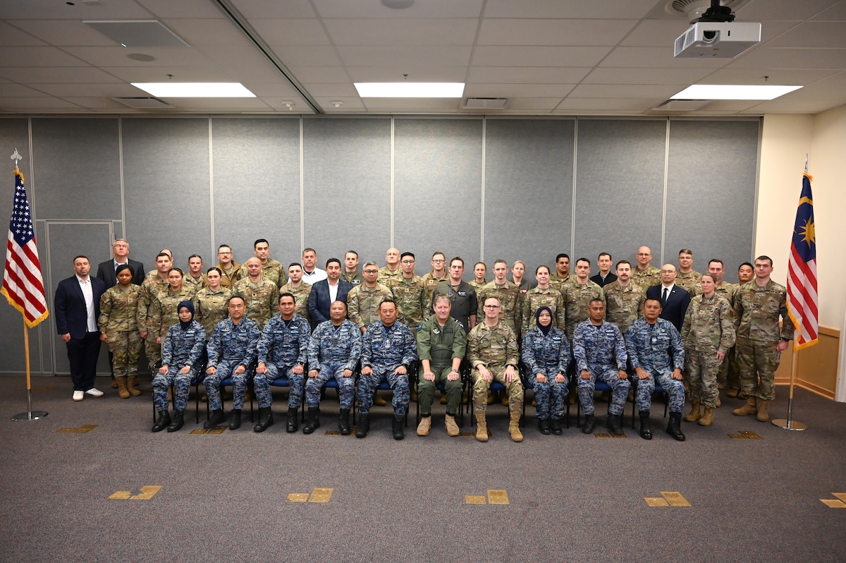 Participants of the Seventh Annual Airman-to-Airman Talks pose for a group photo at Camp Murray, Washington, Feb. 11, 2025. The three-day program focused on professional development, air domain awareness, and strengthening relationships between Pacific Air Forces, the Washington Air National Guard and Royal Malaysian Air Force.