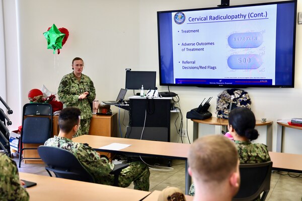 Hospital Corpsman 1st Class Courtney Smith instructs hospital corpsmen during the Sick Call Screener Course (SCSC) at Naval Medical Readiness and Training Command (NMRTC) Twentynine Palms on Feb. 12, 2025. The course, developed by NMRTC Twentynine Palms leadership, enhances medical proficiency by training corpsmen to triage and evaluate acute patients under provider supervision. By implementing the SCSC, the Adult Medical Care Clinic (AMCC) has significantly improved access to care, reducing appointment wait times from six weeks to seven days and ensuring Marines receive timely medical attention to maintain operational readiness (U.S. Navy photo by Christopher C. Jones, NHTP/NMRTC Twentynine Palms public affairs officer).