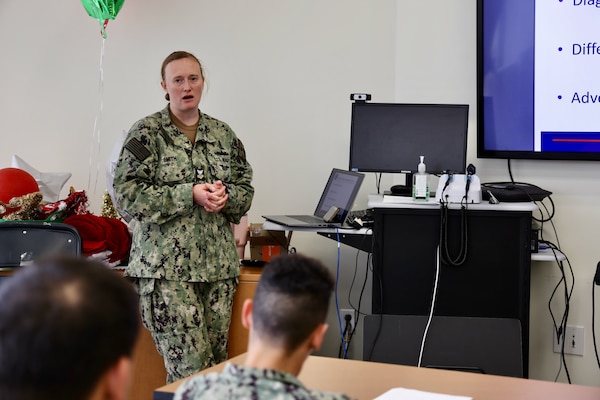 Hospital Corpsman 1st Class Courtney Smith instructs hospital corpsmen during the Sick Call Screener Course (SCSC) at Naval Medical Readiness and Training Command (NMRTC) Twentynine Palms on Feb. 12, 2025. The course, developed by NMRTC Twentynine Palms leadership, enhances medical proficiency by training corpsmen to triage and evaluate acute patients under provider supervision. By implementing the SCSC, the Adult Medical Care Clinic (AMCC) has significantly improved access to care, reducing appointment wait times from six weeks to seven days and ensuring Marines receive timely medical attention to maintain operational readiness. (U.S. Navy photo by Christopher C. Jones, NHTP/NMRTC Twentynine Palms public affairs officer).