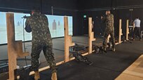 Dr. Brad Fawver and collaborators from the Brazilian Army Research Institute of Physical Fitness (IPCFEx) use an engagement skills trainer (EST). (Courtesy Photo)