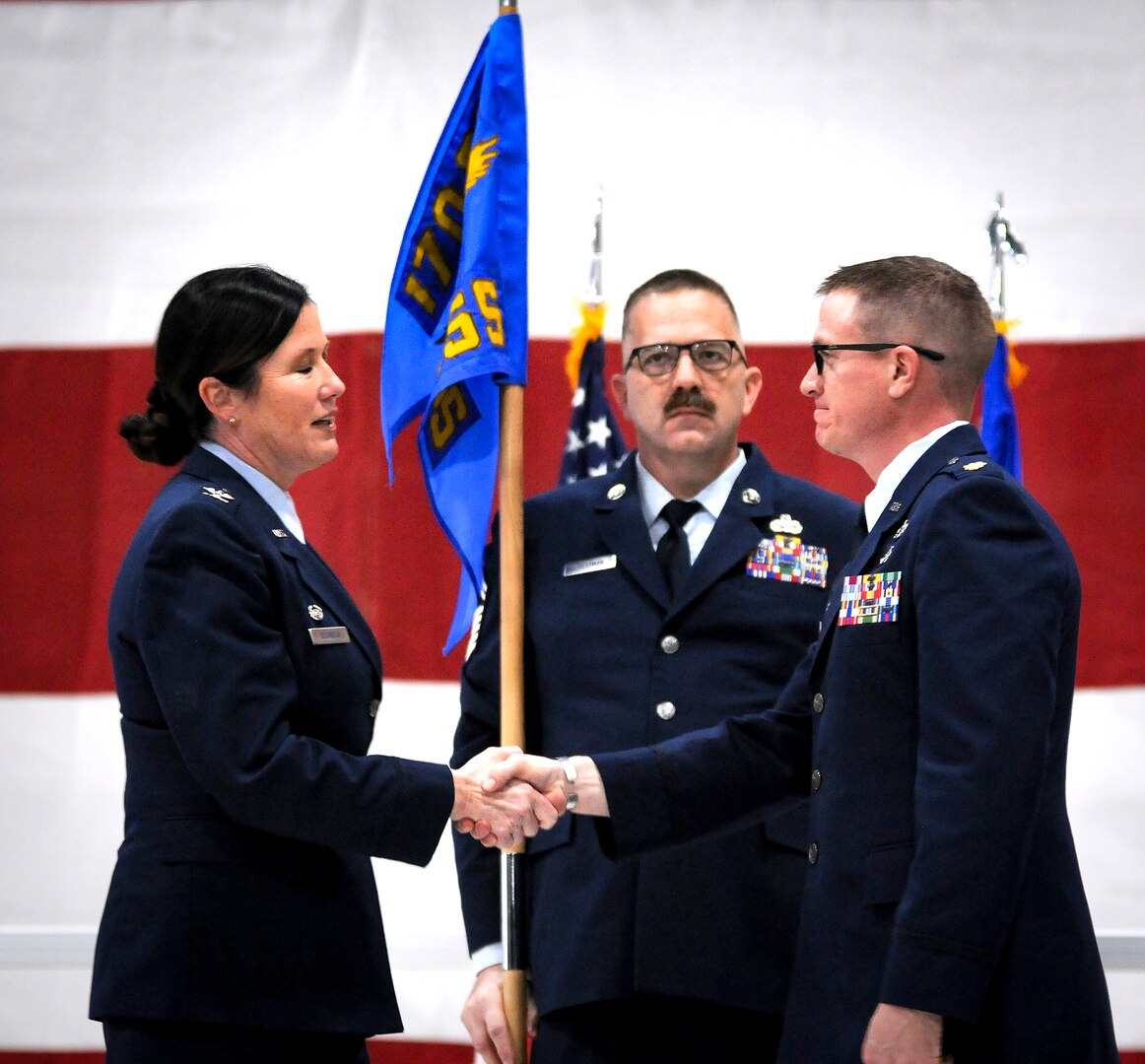 Nebraska Air National Guard Col. Wendy Squarcia, commander of the 170th Group, congratulates Maj. Jordan Jacobs after he assumed command of the Nebraska Air National Guard's 170th Maintenance Support Squadron during a change of command ceremony held Jan. 30, 2025, at Offutt Air Force Base. The 170th Maintenance Support Squadron is a new Nebraska Air National Guard unit that provides maintenance support to the active Air Force's 55th Maintenance Group at Offutt Air Force Base. (Nebraska National Guard photo by Kevin Hynes).