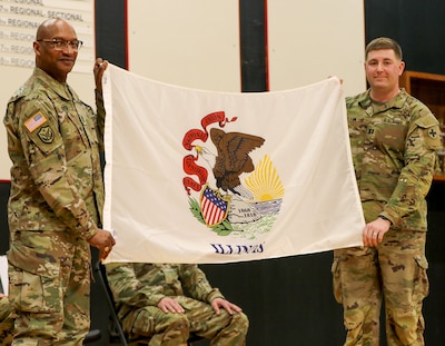 Maj. Gen. Rodney Boyd, The Adjutant General of Illinois, and Commander of the Illinois National Guard, presents Capt. Andrew Klein, Commander, Company B, 2nd Battalion, 130th Infantry Regiment with the Illinois state flag during the unit’s mobilization ceremony Feb. 8 in Effingham.