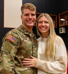 Sgt. Evan Oliver, fire team leader and training noncommissioned officer for Company B, 2nd Battalion, 130th Infantry Regiment, based in Effingham, with wife, Anna, was among the approximately 130 Soldiers from Company B honored at a mobilization ceremony Feb. 8 in Effingham.